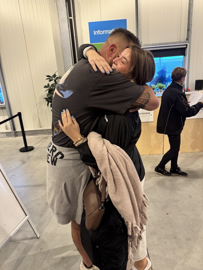 An embrace in a passenger terminal